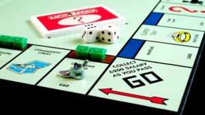 Detailed view of Monopoly board game pieces, dice, and properties.
