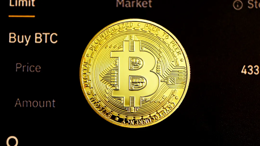 gold round coin on black surface