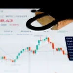 a close up of a business card with a stock chart on it