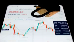 a close up of a business card with a stock chart on it