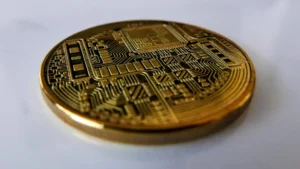 a close up of a coin on a white surface