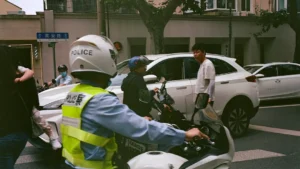 a group of people riding motorcycles down a street