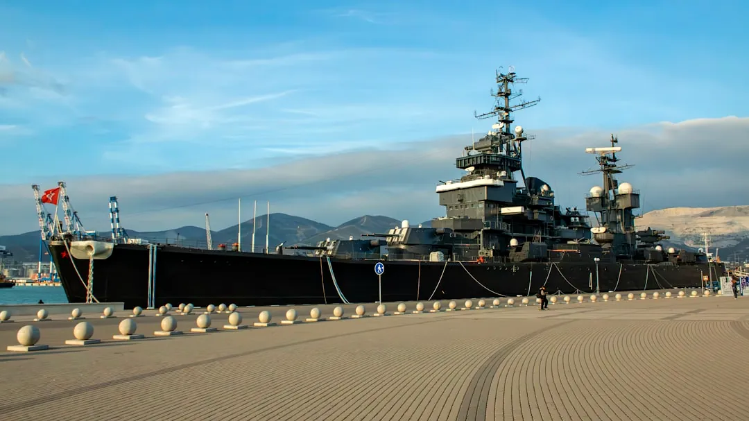 A large ship sitting on top of a sandy beach