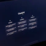 Close-up of a computer screen displaying ChatGPT interface in a dark setting.