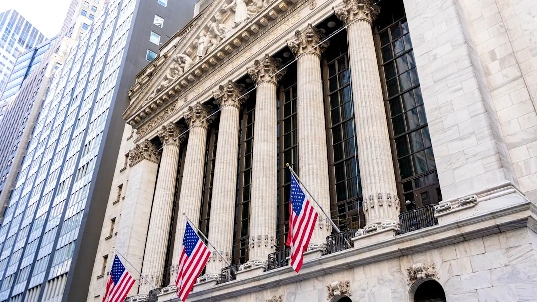New york stock exchange building with american flags.
