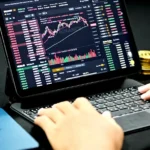 person using black and gray laptop computer