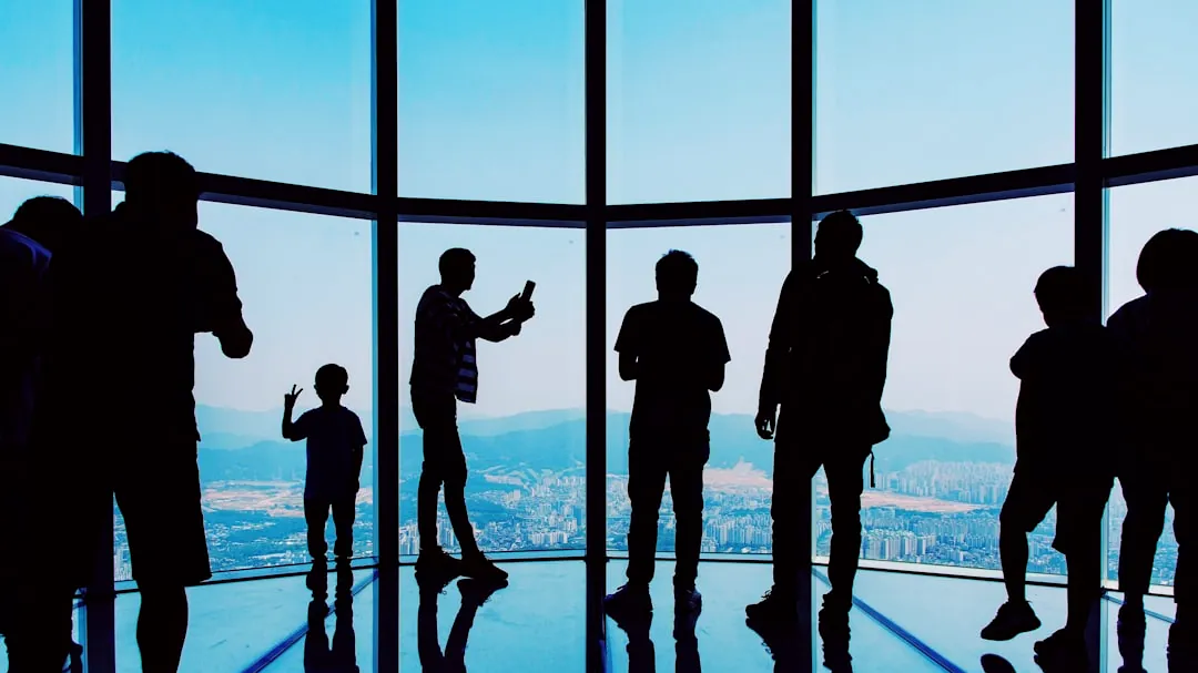 silhouette of people taking selfies