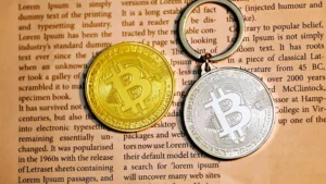 silver round coin on white printer paper