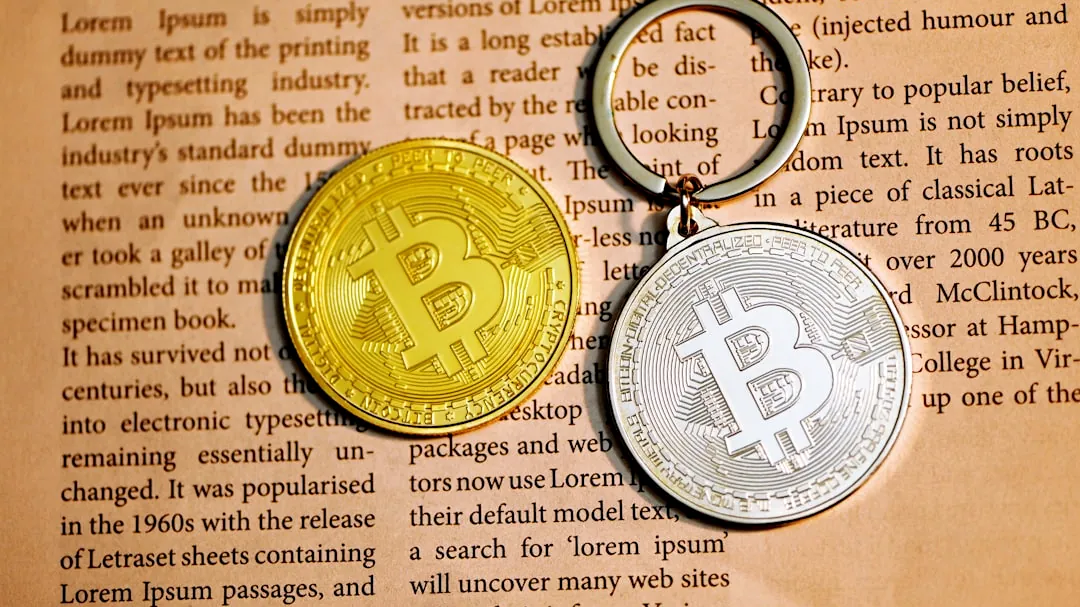 silver round coin on white printer paper