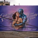 Billboard with woman and robot embracing
